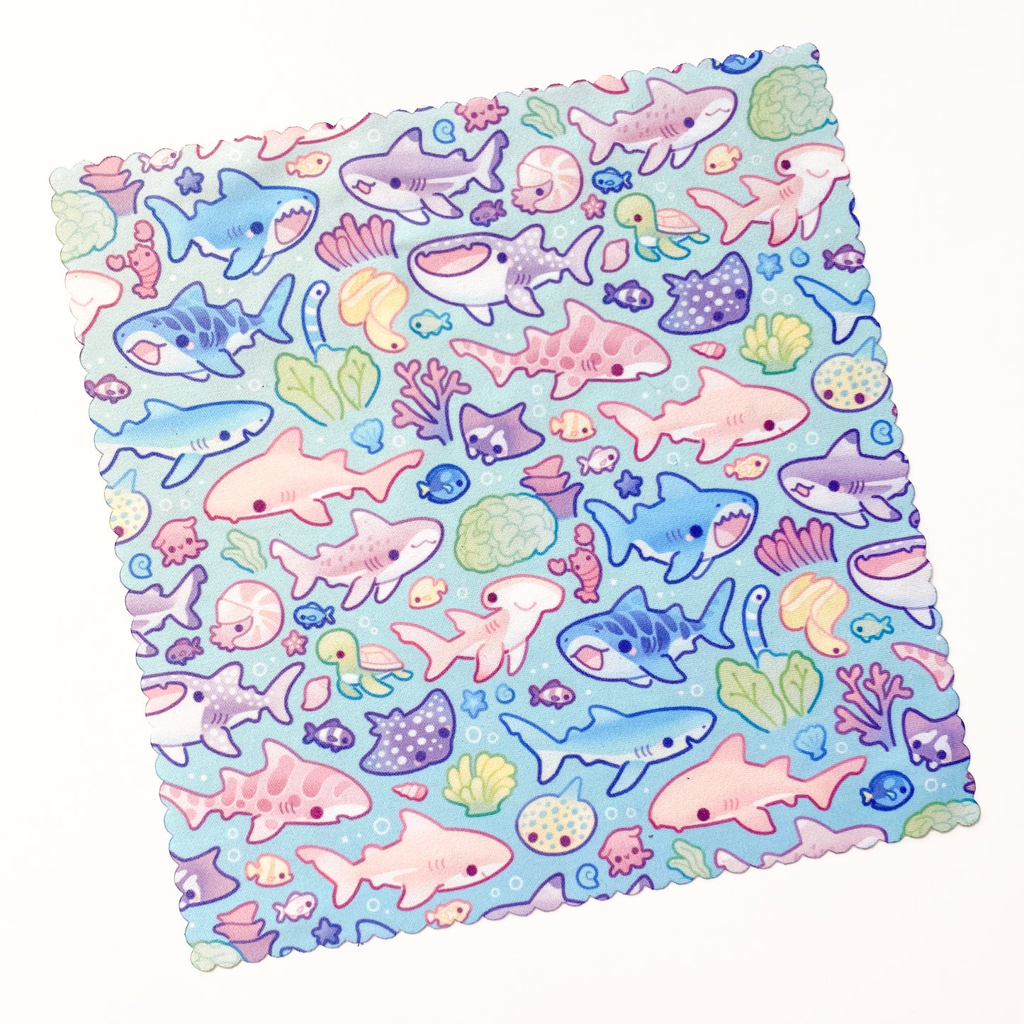 hand-drawn pattern made by an artist. The sharks are very cute, kawaii and friendly looking! Many colours