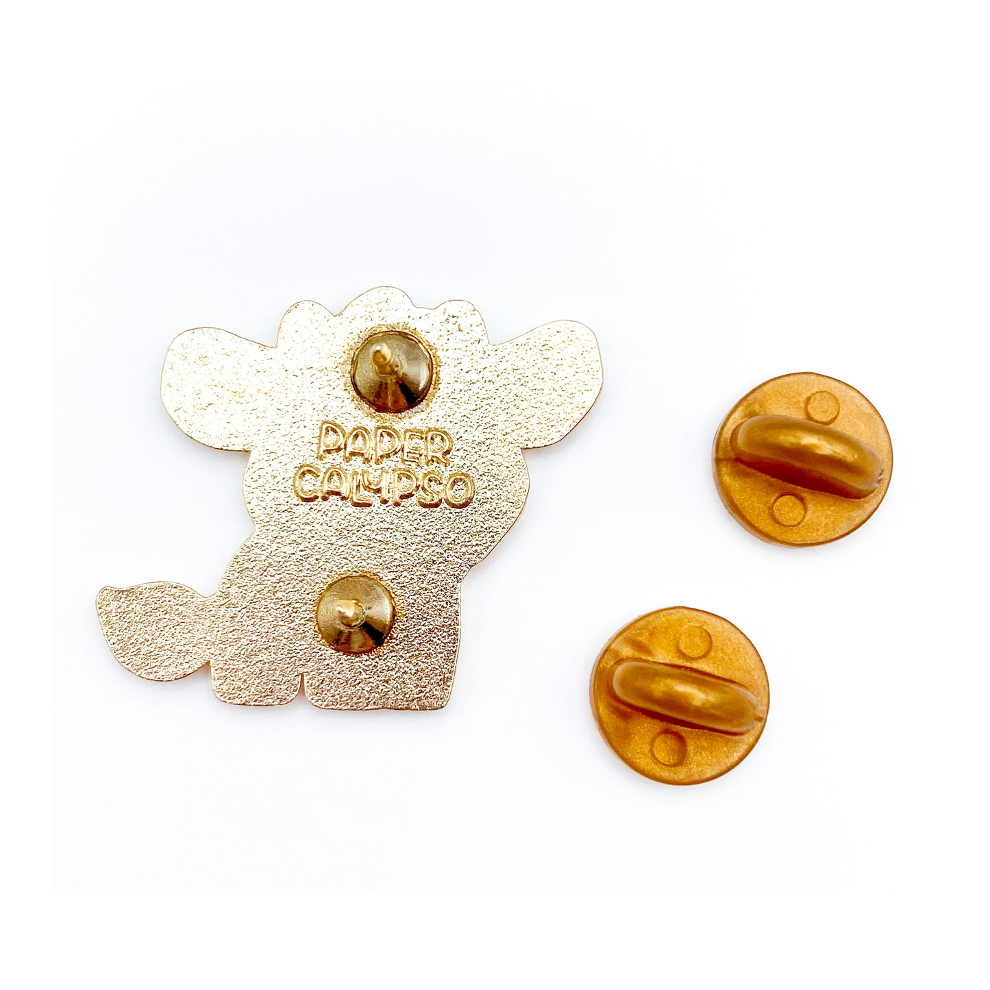 there are two pins on the back for extra security! This way you won't lose your pin if you put it on your clothes or bag. It comes with gold colored rubber clasps. The back of the pin has a stamp with my watermark and reads "Paper Calypso"