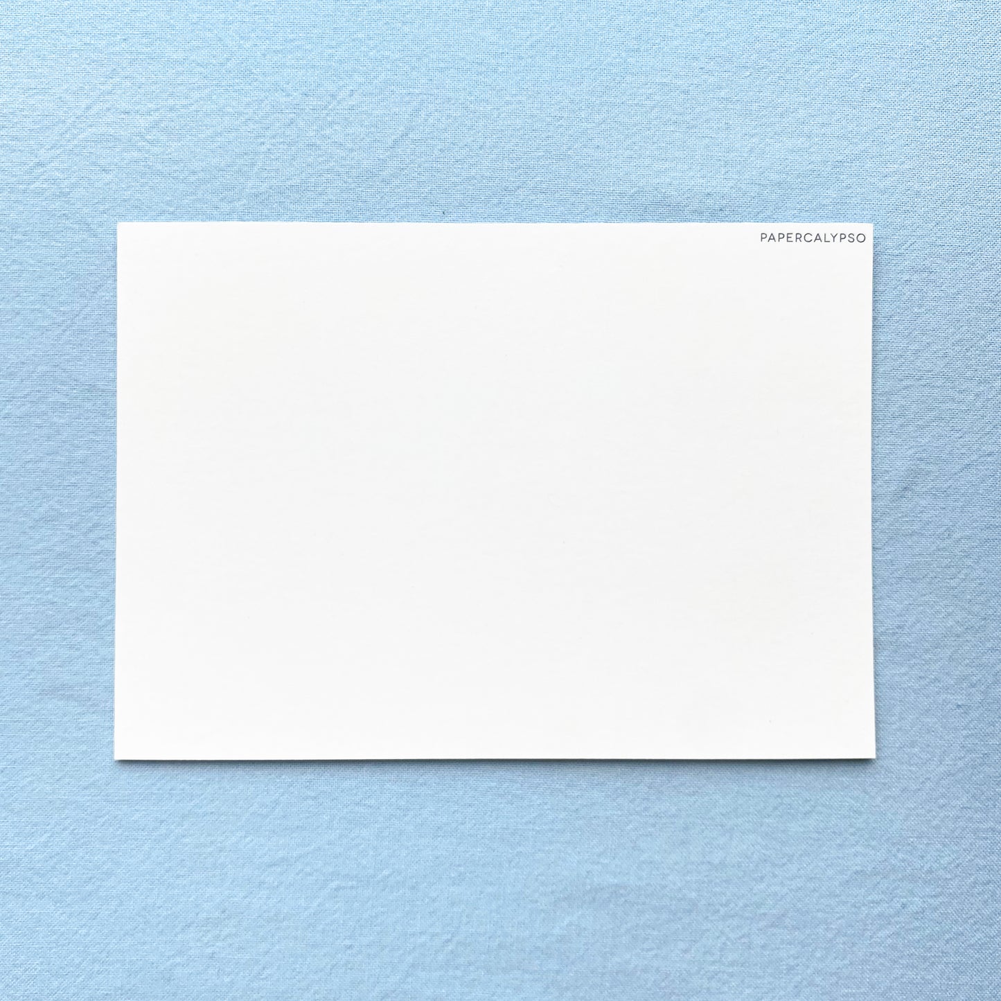 on the back is lots of space to write a message, the only thing printed there is a little watermark "Papercalypso" in the corner.