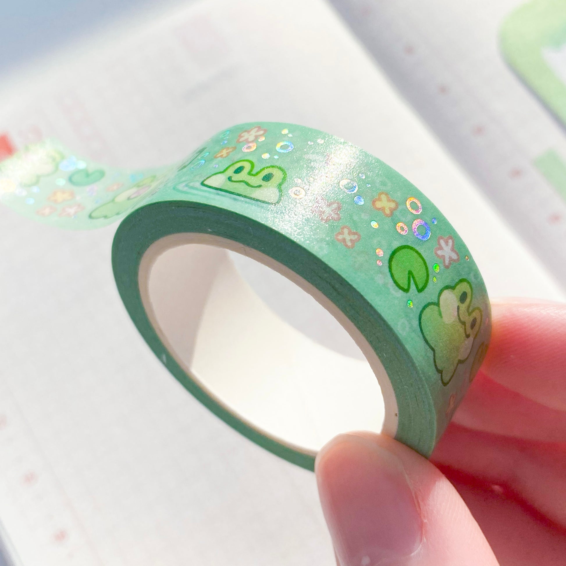 a close-up showing the details of the washi tape in the sunlight. The holographic foil reflects rainbow colours when it is at the right angle.