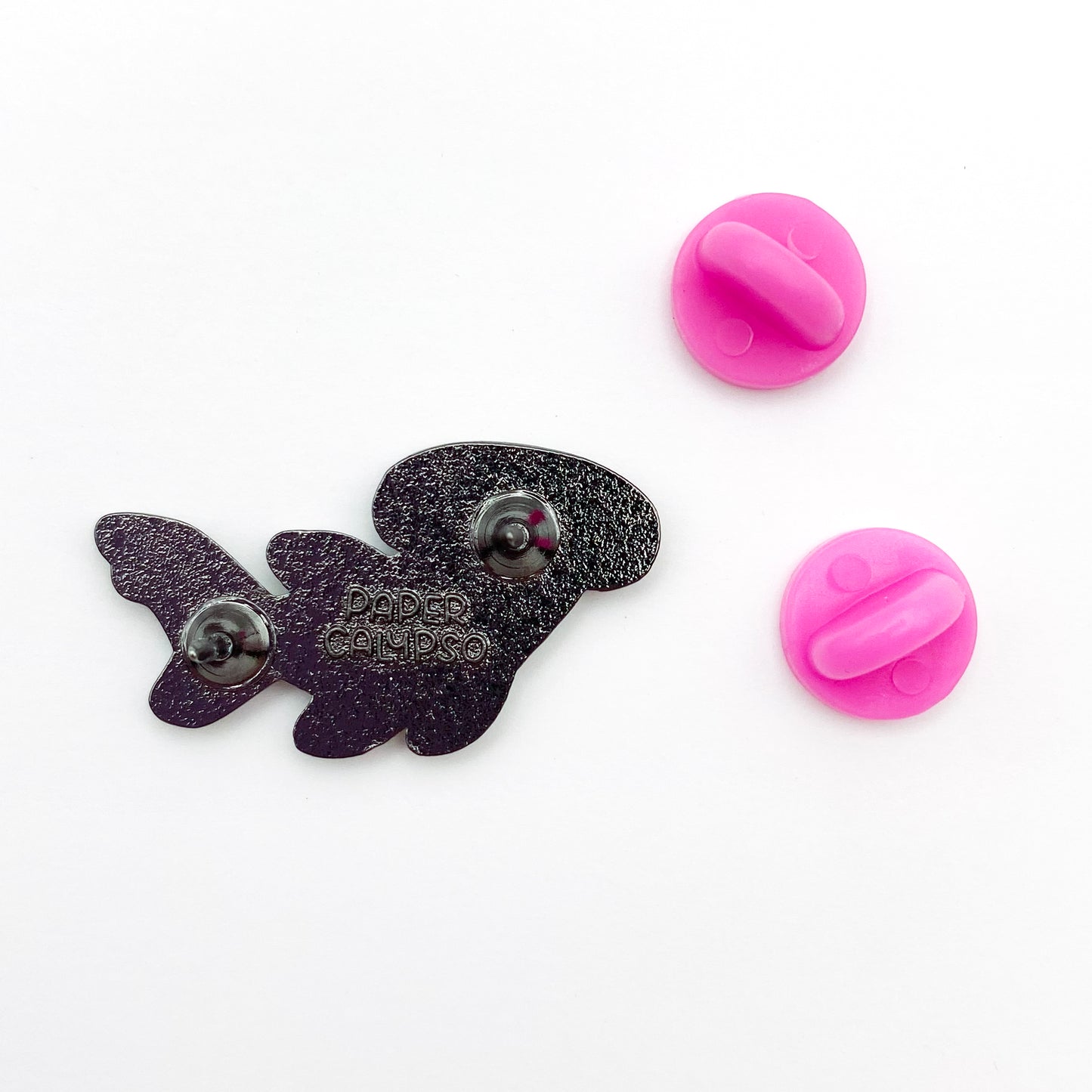 there are two pins on the back for extra security! This way you won't lose your pin if you put it on your clothes or bag. It comes with pink rubber clasps. The back of the pin has a stamp with my watermark and reads "Paper Calypso"