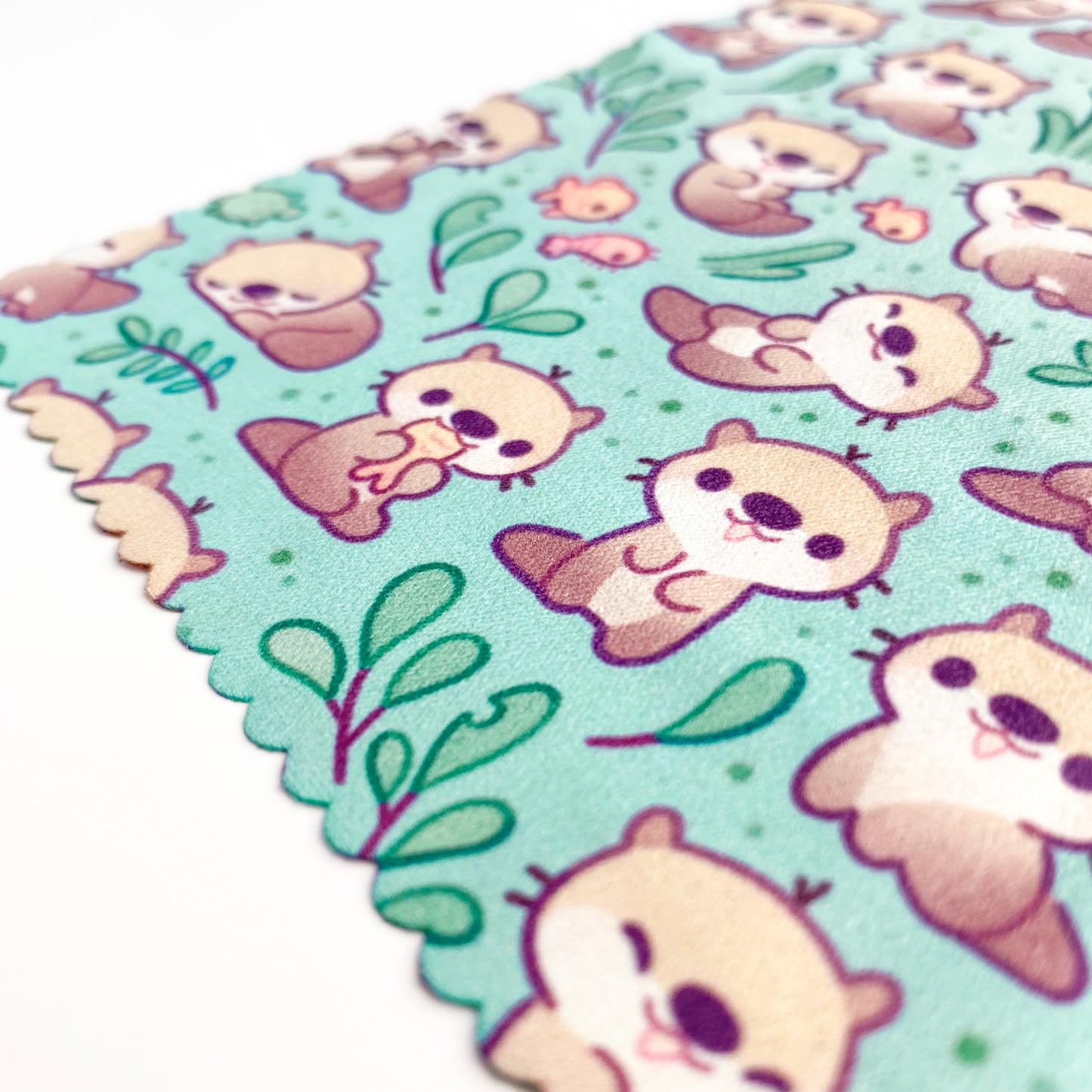 brown river otters swimming. Painted by a small artist hand-made small-business. Printed on soft cloth.