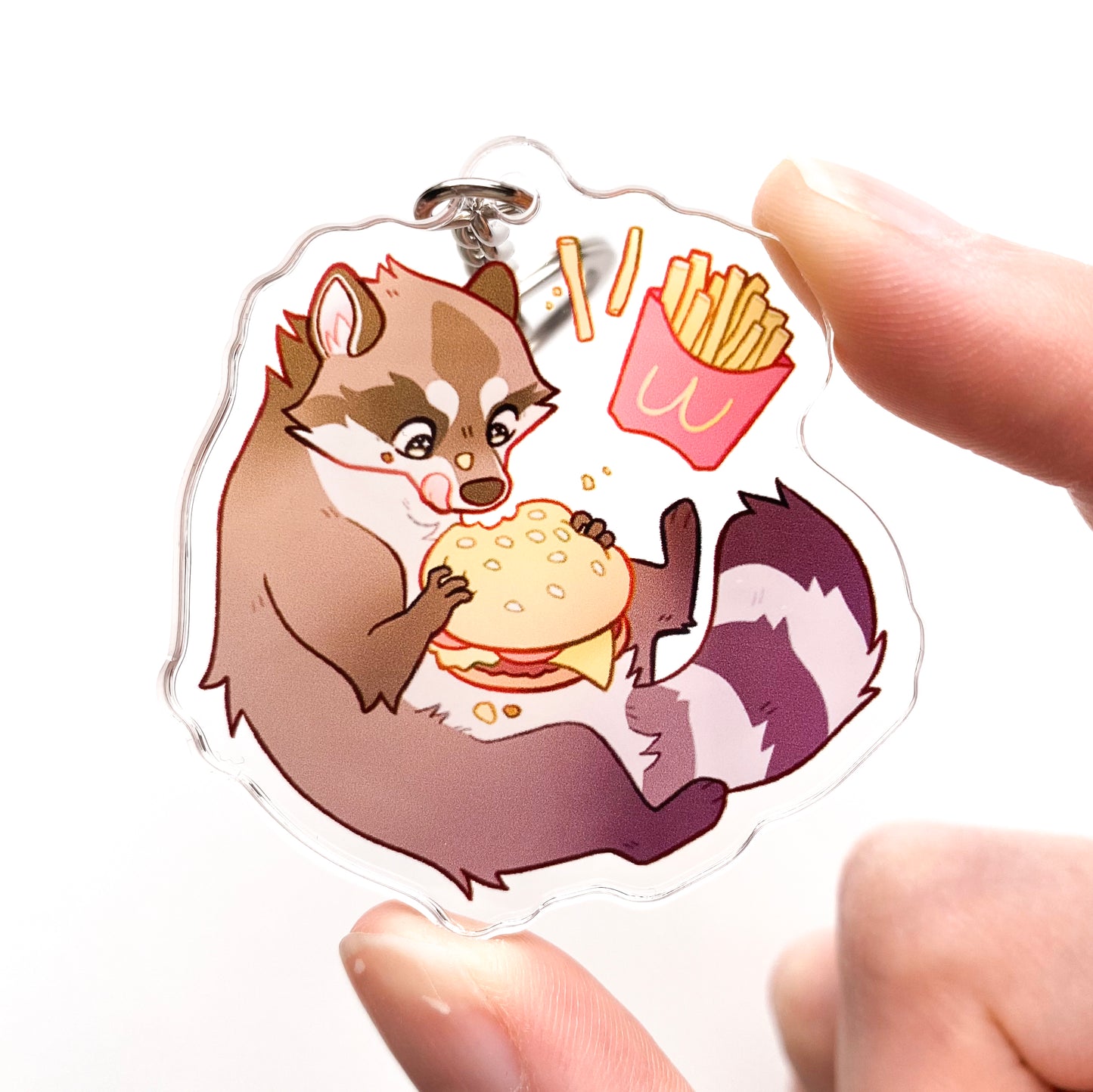a picture of me holding the keychain, so you get a better feeling for its size. That hamburger sure does look plump and yummy!