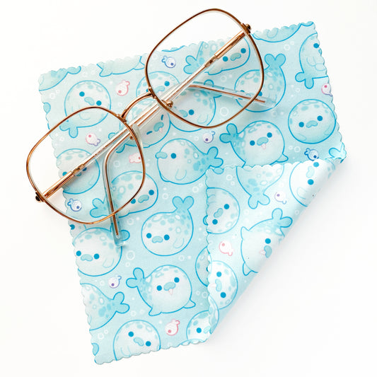 some pastel teal turqouise blue seals on a microfibre cloth to clean your sunglasses, glasses, reading glasses, camera lenses or screens! Cute, round, kawaii.