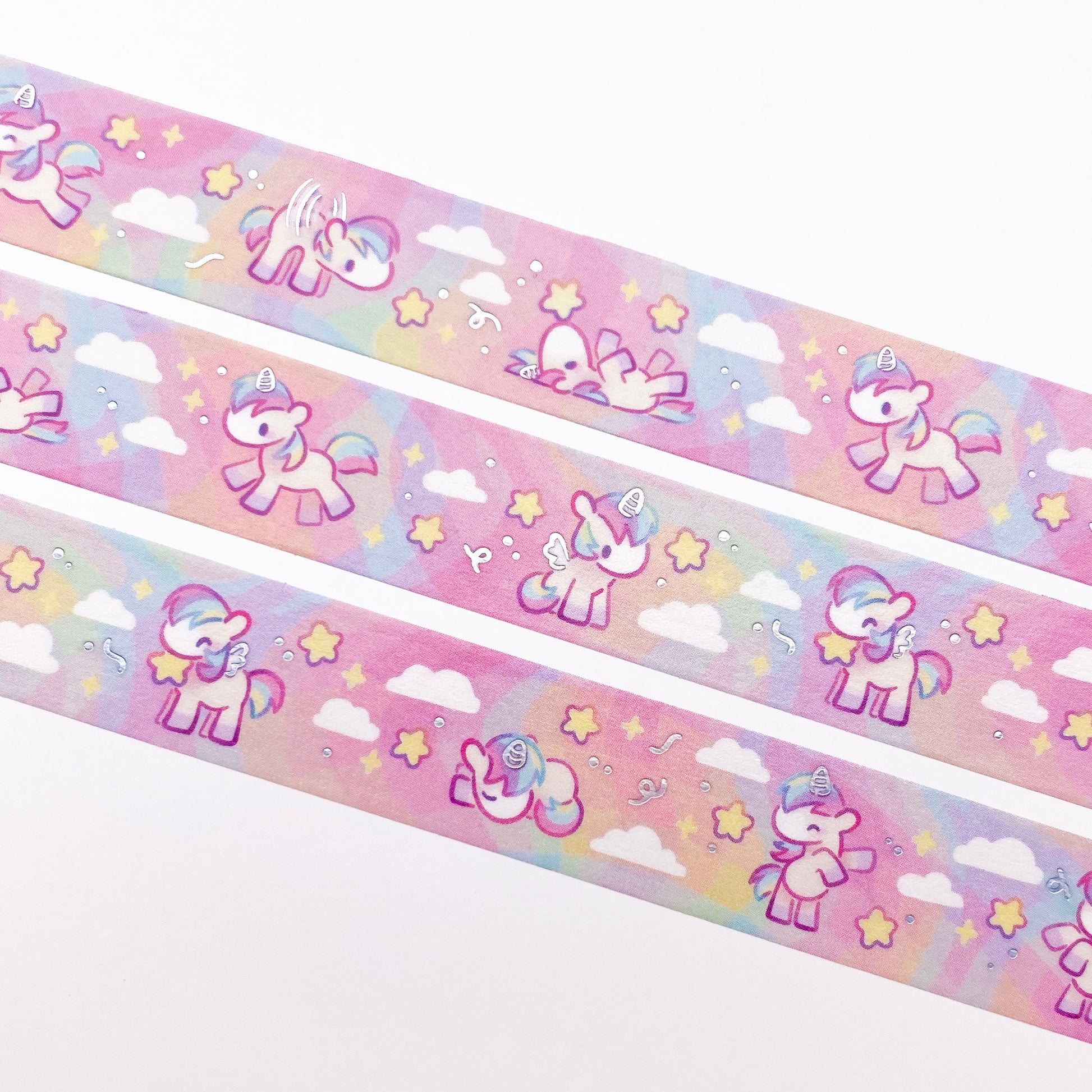 A close-up of the washi tape. The horses are surrounded by chunky, round stars and white fluffy clouds.