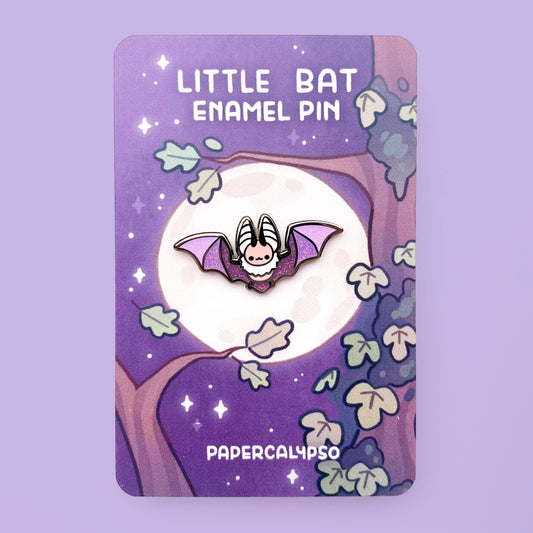 A black nickel hard enamel pin of a brown long-eared bat. He has cute long ears and a fluffy neck. His wings are sparkly purple glitter enamel.