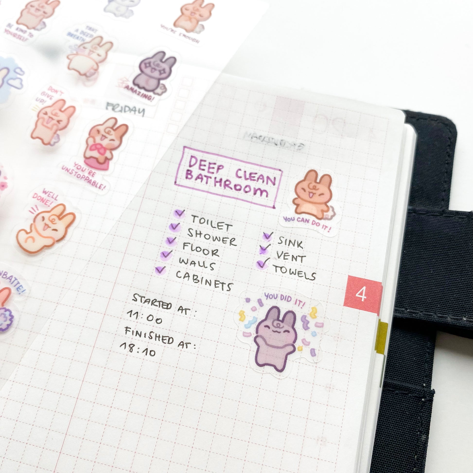 an example of how to use the stickers in a hobonichi journal. Use them to decorate your difficult to-do lists and work tasks. One bunny is saying "You can do it!" and another is saying "You did it!" and throwing confetti. The stickers are matte and transparent, so you can see the journal paper patterns through the stickers.