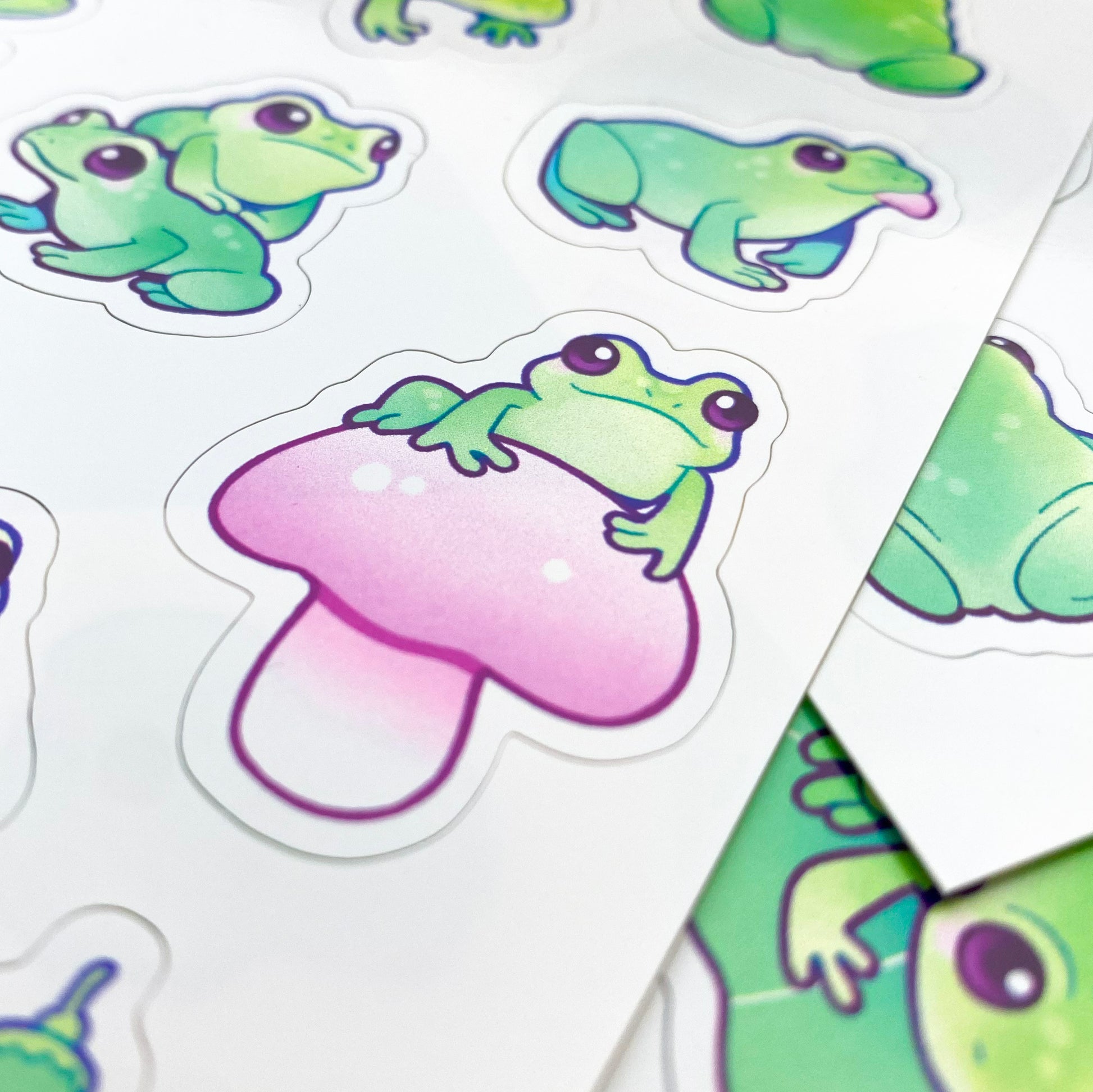 A close-up of the sheet, showing the texture of the matte vinyl and the good print quality. The frog in the picture is sticking out it's tongue and smiling.