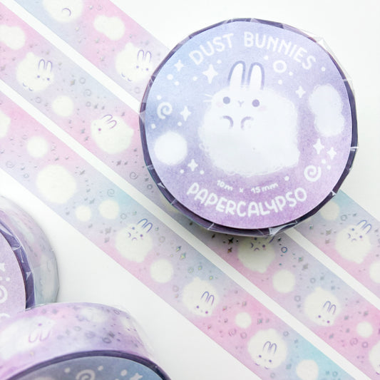 kawaii dust bunny themed washi tape featuring round, white cartoon rabbits on a pastel pink background. The bunnies are calmly floating around and enjoying their existence as little balls of dust.