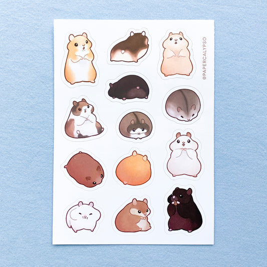 The hamsters are all different colours, from brown to ginger to black or white. They are very pudgy and round, many of them have fully stuffed cheeks. Their hands are very small and stubby. The sticker sheet has thirteen unique stickers printed on white matte thin vinyl. This makes them sturdy and waterproof, but not too thick to use in a journal.