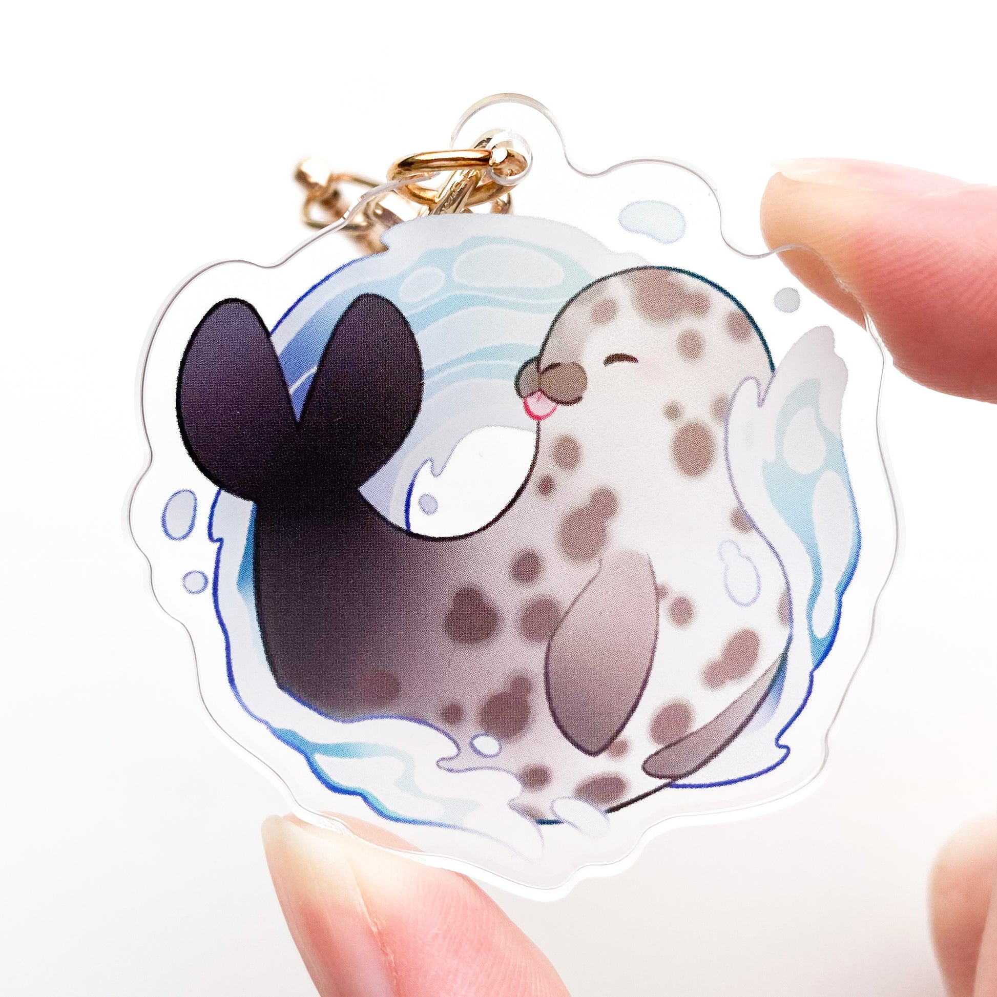 a picture of me holding the keychain to better showcase its size.