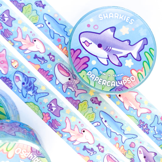 kawaii shark themed washi tape featuring a coral reef full of marine life. The sharks are happily swimming in a colourful underwater world along with the fish eels and clams!