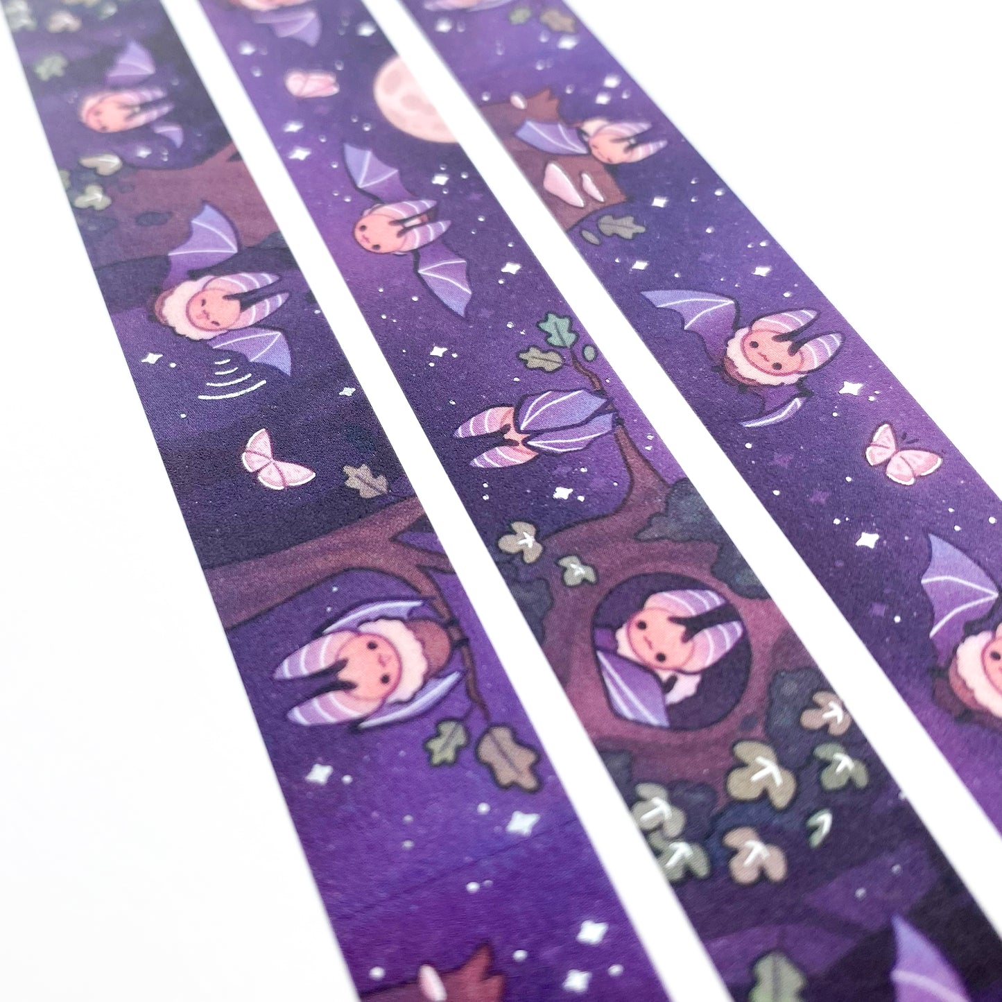 A different angle showing the holographic silver foil reflecting in the light. The foil is used for highlights and on the stars in the sky.