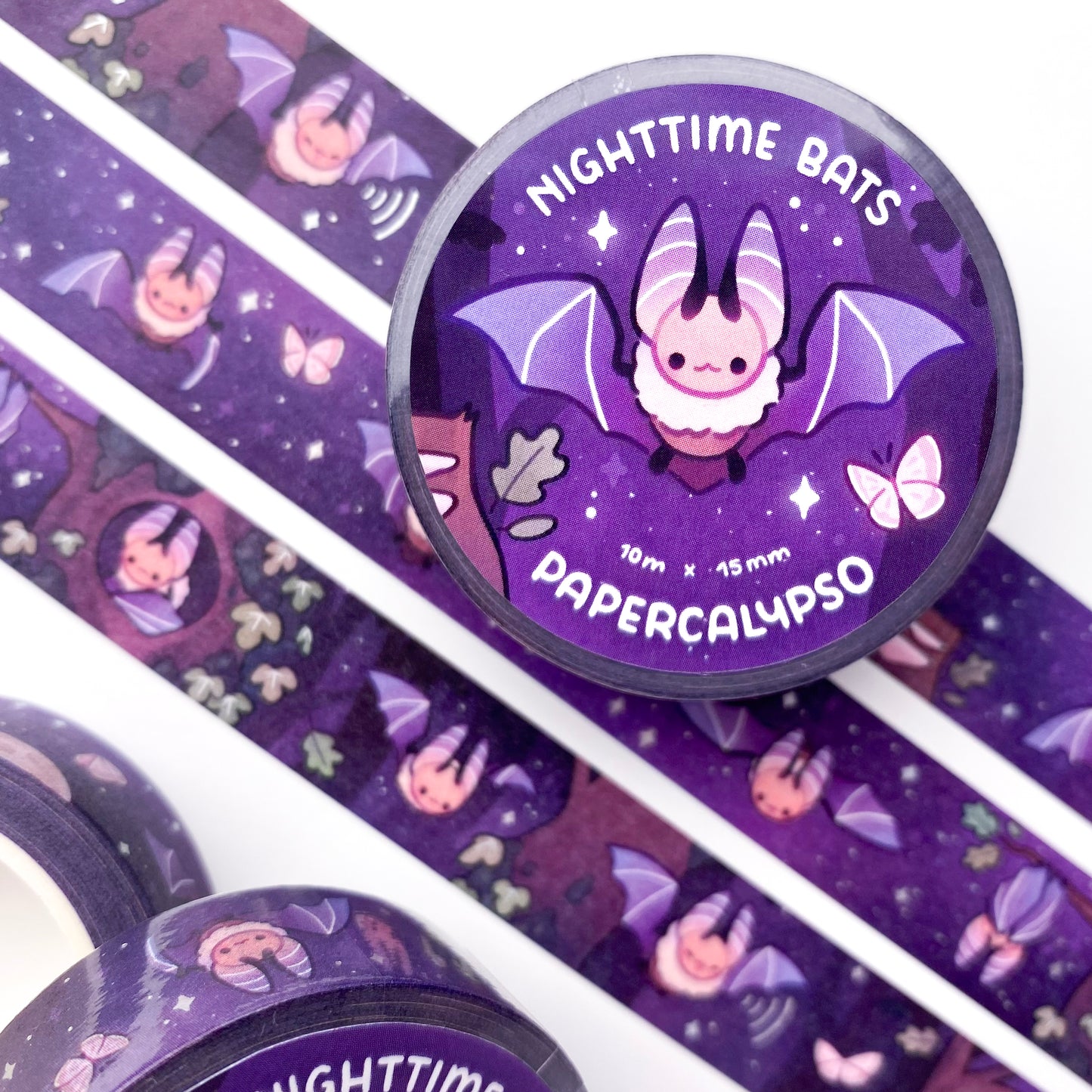 kawaii bat themed washi tape featuring a nighttime forest scene full of bats. It's the night of the full-moon. Some bats are flying about, while others are resting in the ivy-covered oak trees.