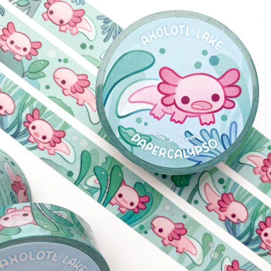 kawaii axolotl-themed washi tape featuring pink axolotls swimming in a green lake full of plants. They're surrounded by greenery, tree roots and bubbles.
